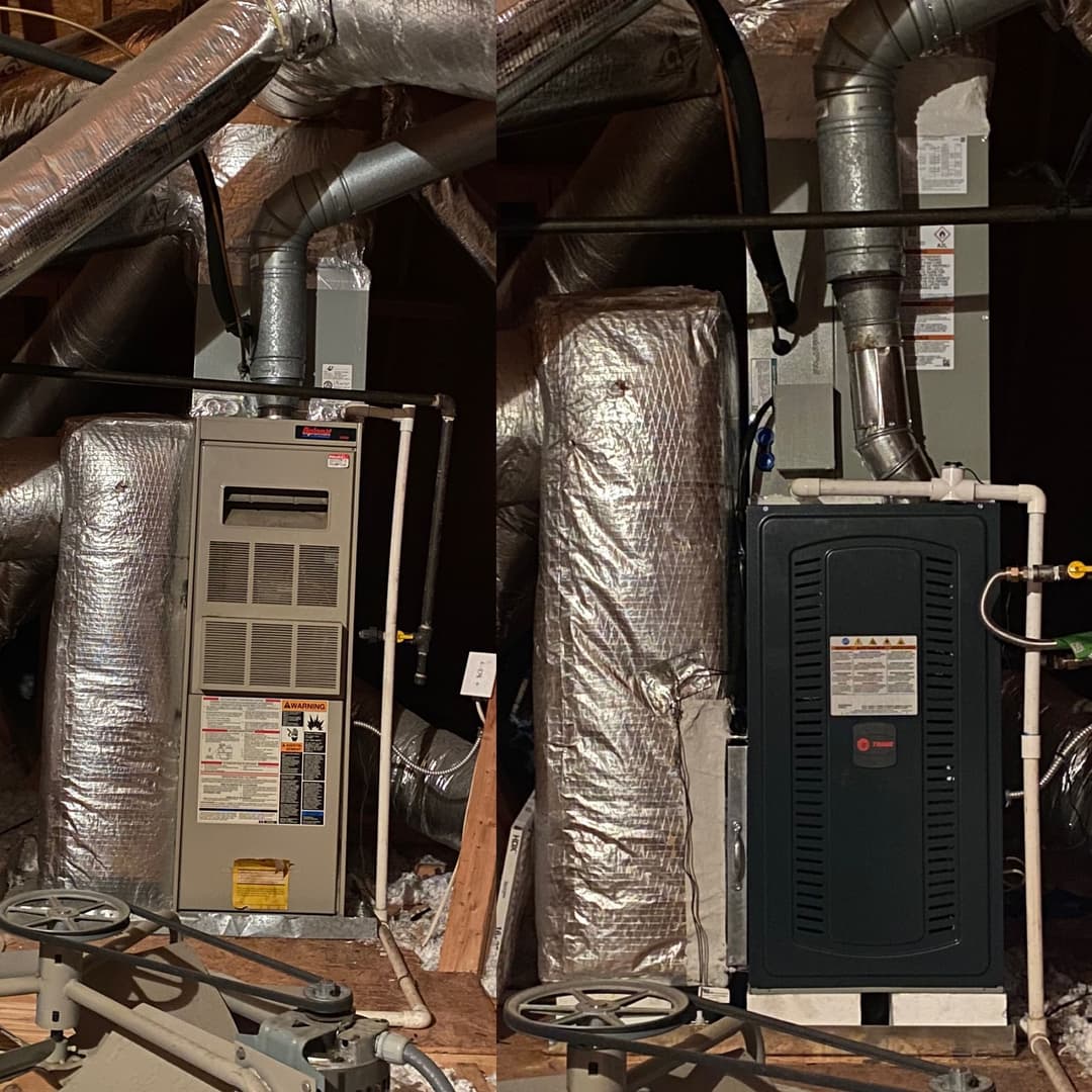 Heating system installation in an attic with insulated ducts and two furnaces.