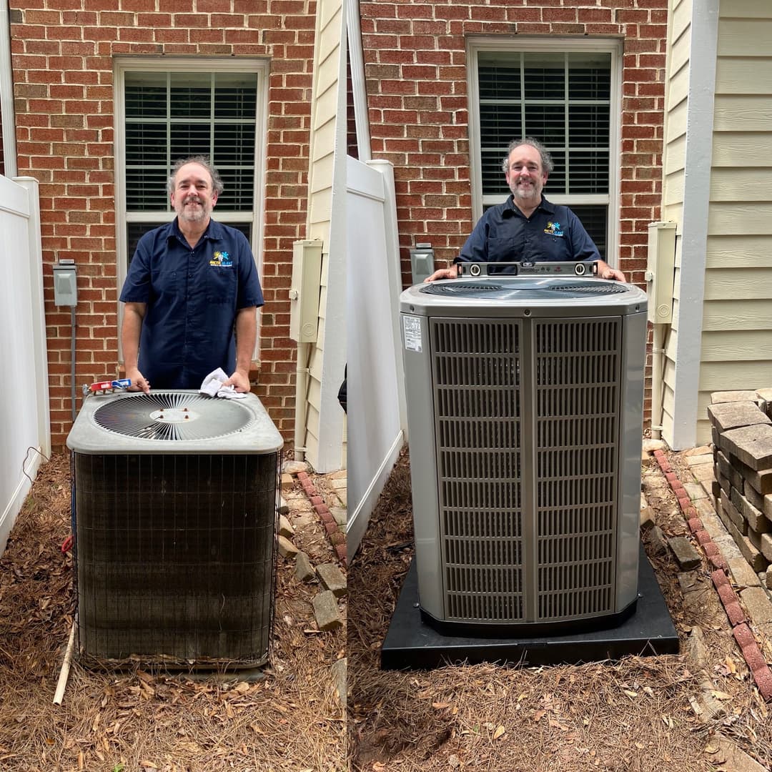 Technician replacing old air conditioner with new unit outside residential home.