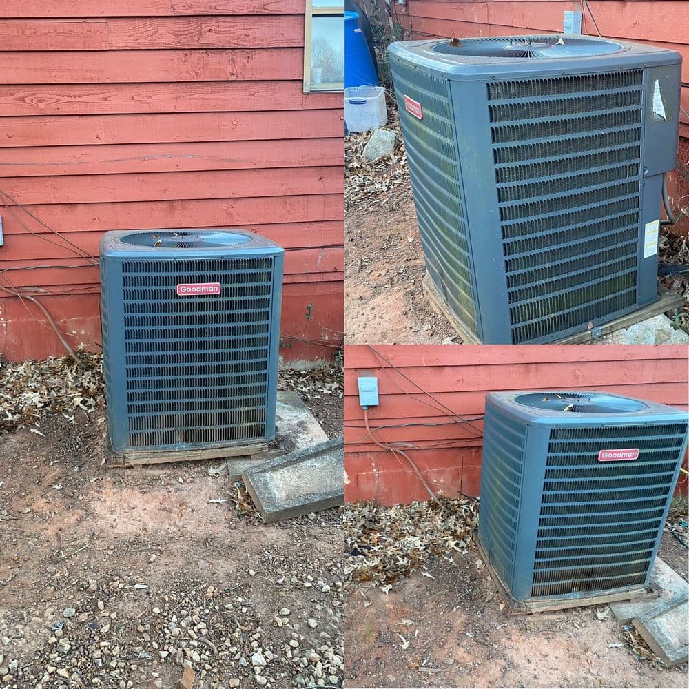 Air conditioning unit outside red house, showing detailed angles and surrounding debris.
