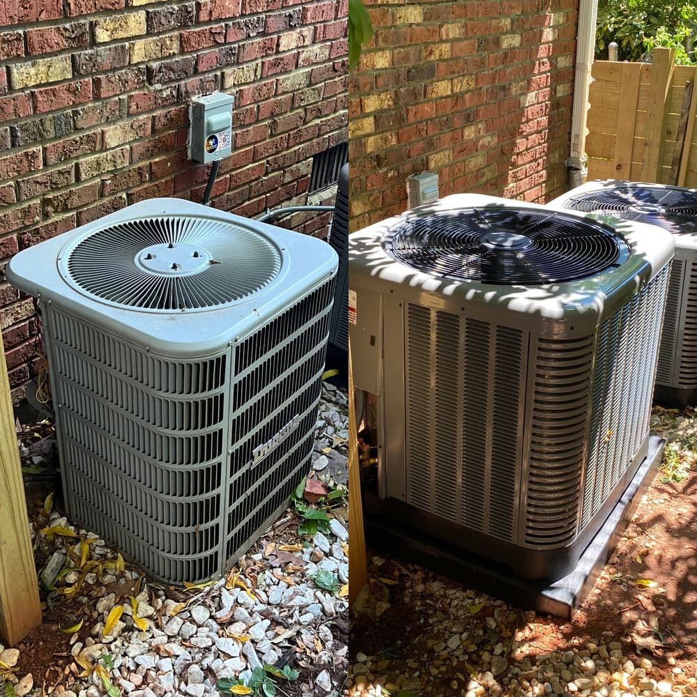 Air conditioning units beside a brick wall, showcasing outdoor HVAC systems and landscaping.